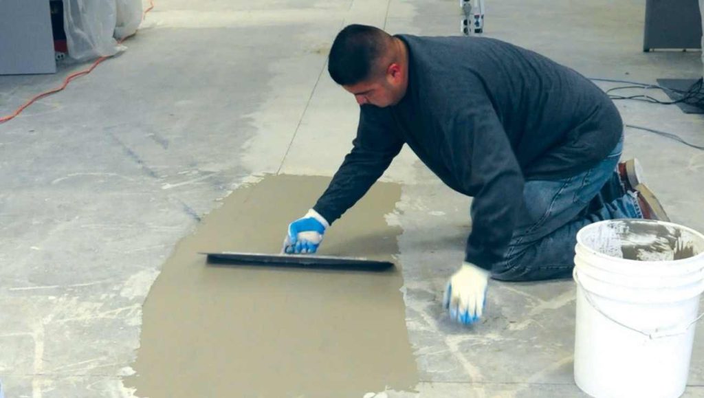 Skim coat applied to a concrete garage floor before epoxy coating