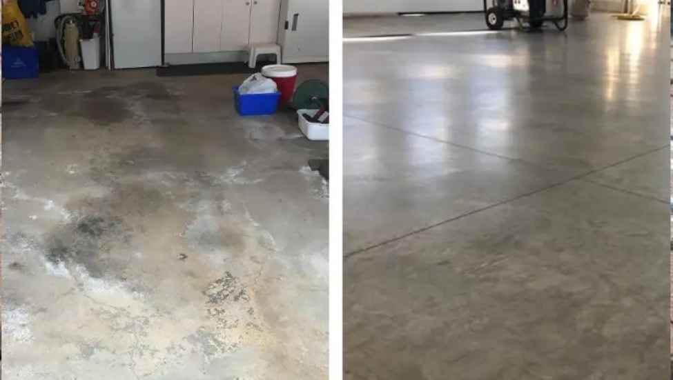 Professional applying a clear concrete sealer with a roller to a clean, dry residential garage floor, realistic photography, smooth concrete surface, natural light, no branding, no text.
