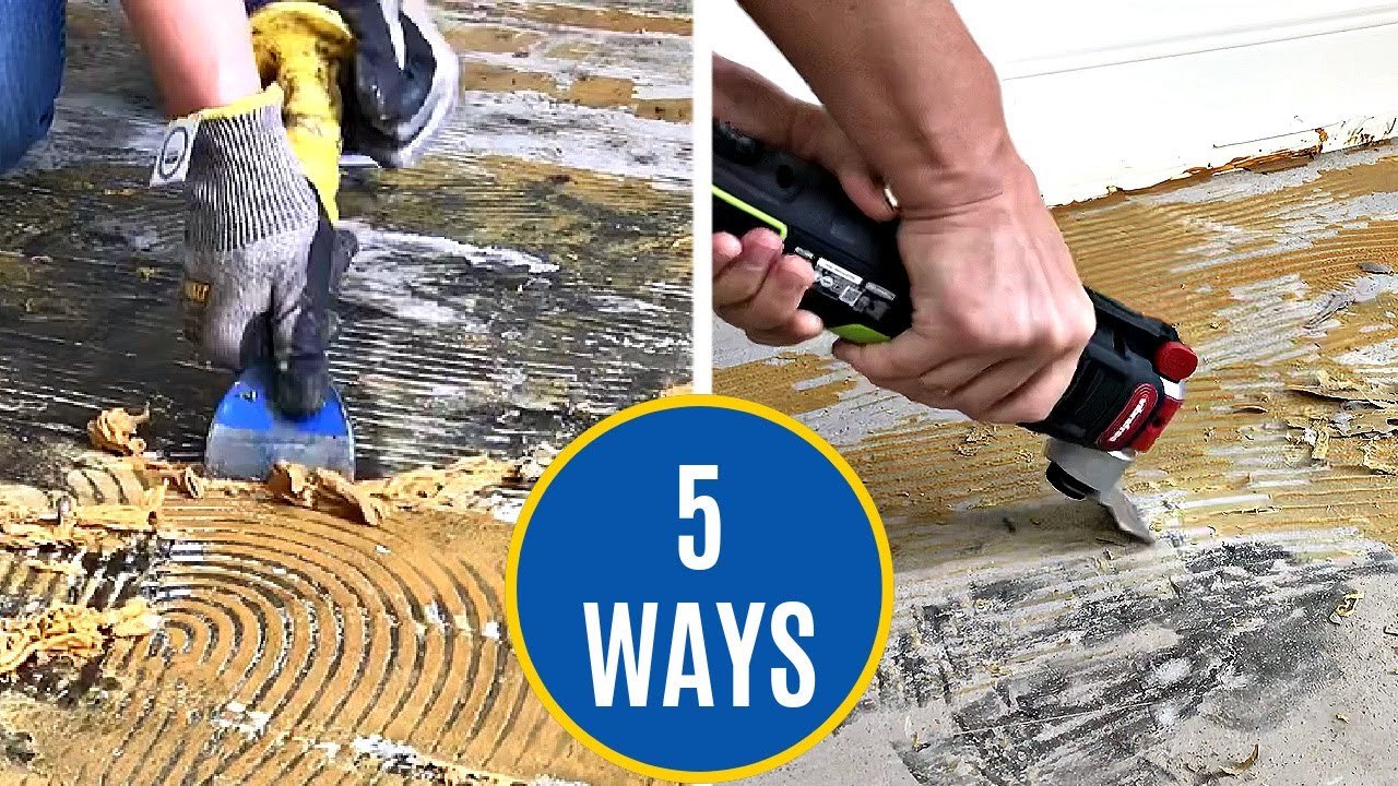 Scraping adhesive residue from a concrete garage floor before epoxy coating